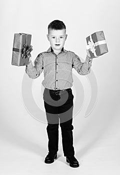 Birthday gift. Small boy hold gift box. Christmas or birthday gift. Dreams come true. Buy gifts. Holiday shopping