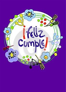 Birthday greeting card, with colorful floral decoration in naive art style. Text in Spanish says Happy Birthday photo