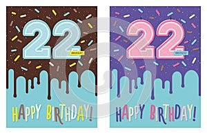 Birthday greeting card with glaze on decorated cake and number 22 celebration candle