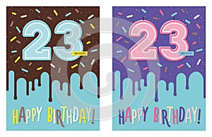 Birthday greeting card with glaze on decorated cake and number 23 celebration candle