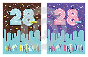 Birthday greeting card with glaze on decorated cake and number 28 celebration candle