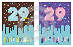 Birthday greeting card with glaze on decorated cake and number 29 celebration candle