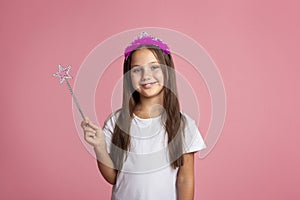 Birthday and little fairy. Beautiful little girl with crown and magic wand