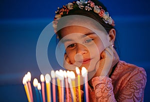 Birthday. A little sweet girl blows out candles on the stoke