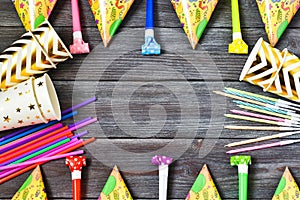 Birthday party background.Decoration for the party. design concept. Candles, confetti, candies and party supplies on wooden backgr