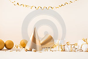 Birthday or party background with golden balloons, gift box, carnival cap and confetti stars