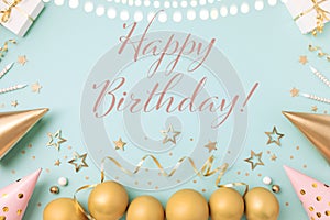 Birthday party background with golden decoration from gift box, balloons, carnival hat, candles, confetti, candy and streamers