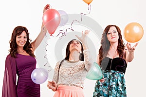 Birthday party celebration - three woman with ballons having fun