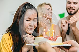 Birthday party cute teen girl prayed for blessing before blowing the birthday cake