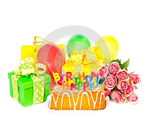 Birthday party decoration with roses flowers, cake, balloons, gi