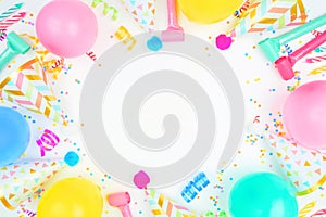 Birthday party frame on a white background with balloons, party hats, streamers and confetti