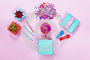 Birthday party, gift boxes, red bow, colorful candy, flat lay, stars