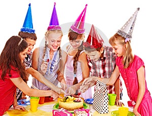 Birthday party group of child with cake.