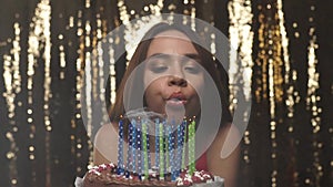 Birthday Party. Happy Woman Blowing Candles On Cake Portrait