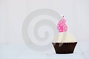 Birthday's cake - muffin with a candle in the shape of a figure 6. Happy birthday !