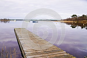 Biscarosse lake wooden ponton on water for boat fishing
