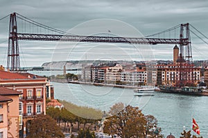 Biscay bridge flying with gondola over river Nervion. Portugalete landmark. Famous bridge called Puente de Vizcaya near Bilbao.