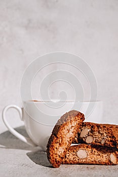 Biscotti Cantuccini Cookie Biscuits with Almonds Shortbread. White cup of coffee and traditional homemade italian