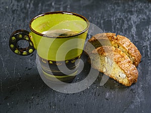 Biscotti with coffee on a slate background