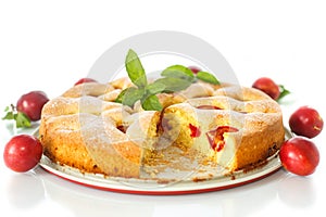 Biscuit cake with cherry plums
