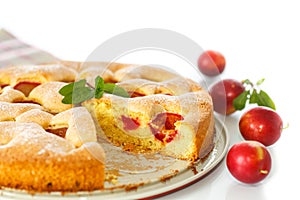 Biscuit cake with cherry plums