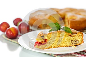 Biscuit cake with cherry plums