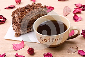 Biscuit cake with cup of coffee