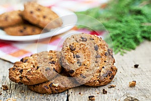 Biscuits with chocolate on rustic table.Biscuits sweet cookie background.