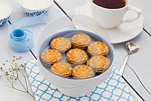 Biscuits and a cup of tea on a wooden table