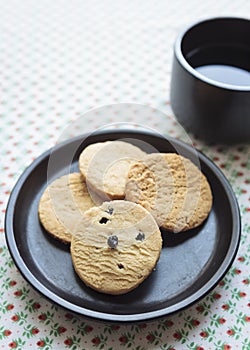 Biscuits on plate with coffee photo