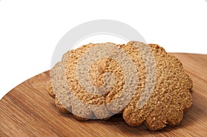 Biscuits in the shape of a flower on the wooden board