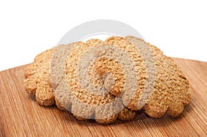 Biscuits in the shape of a flower on the wooden board