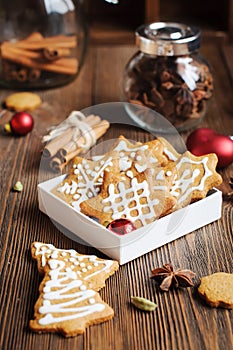 Biscuits shaped in Christmas trees and stars