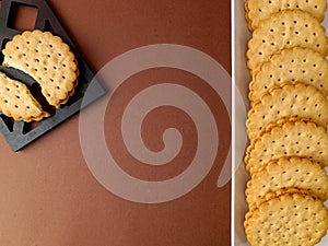 biscuits on white dish , round biscuits on brown background, close up