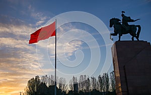 Bishkek, Kyrgyzstan: Monument for Manas, hero of ancient kyrgyz epos, together with national Kyrgyzstan flag on Bishkek central Al