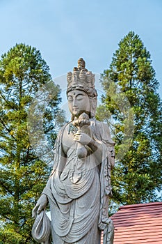 Bisho Kannon Smiling statue at gansho-in buddhist temple in Obuse village, Japan.