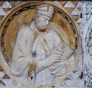 Bishop sculpture in the Church of Sant Agostino in San Gimignano, Italy photo