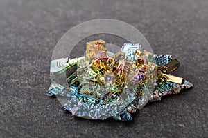 Bismuth crystals on a dark background. This is the most strongly diamagnetic element and also the heaviest that is not radioactive