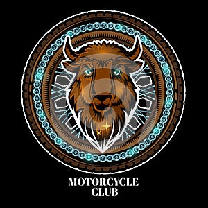 Bison`s head in center of motorcycle wheel, color logo on black background