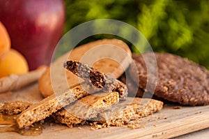 Bisquits with honey and honey dipper and fruits