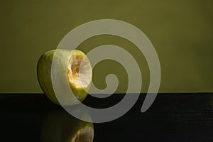 Bit green apple, green on one side and green mirror table