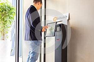 Bitcoin atm and businessman