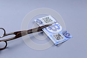 Bitcoin banknote and a scissors