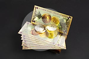 Bitcoin banknotes and golden btc coins on the treasure trove, cryptocurrency in wooden chest, gift, decoration on black paper