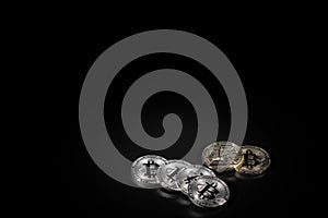 Bitcoin on black background with reflection