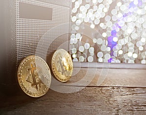 Bitcoin with blurred christmas background with light bokeh