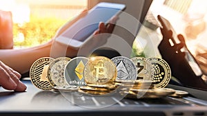 Bitcoin BTC cryptocurrency coin with altcoin digital crypto currency tokens, ETC Ethereum, ADA Cardano, LTC Litecoin, IOTA Miota