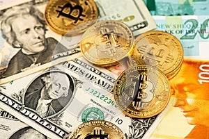 Bitcoin BTC cryptocurrency coins on US Dollar USD and Israel Shekel ILS. photo