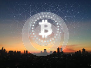 Bitcoin BTC glow led sign over sunrise and city background.