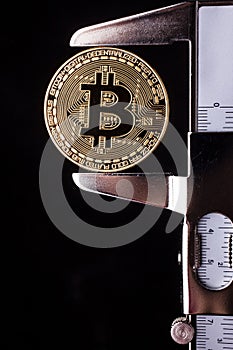 Bitcoin and calibre on black background - cryptocurrency